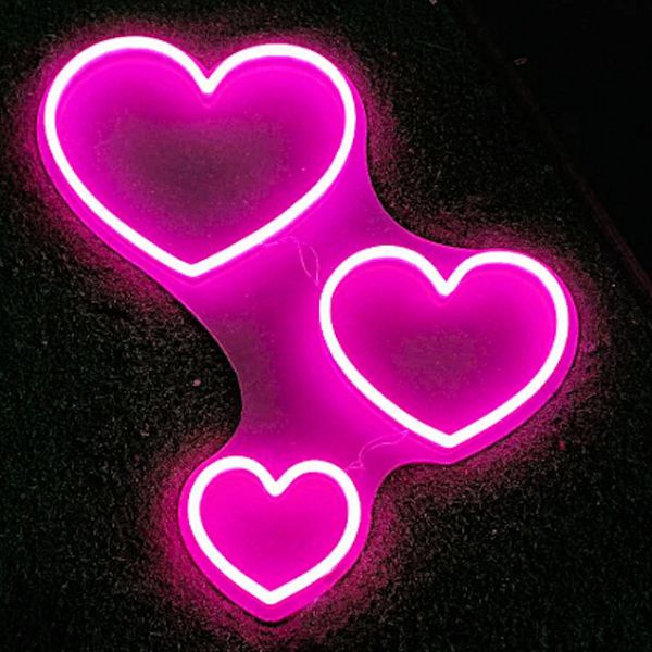 Three Hearts Light Up Wall Art shown illuminated - photo from CustomNeon.com