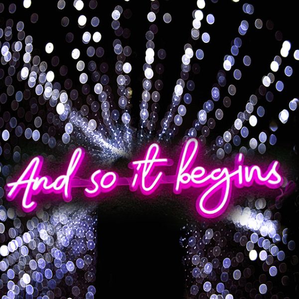 And So It Begins Neon Flex wedding sign in pink - photo from CustomNeon.com