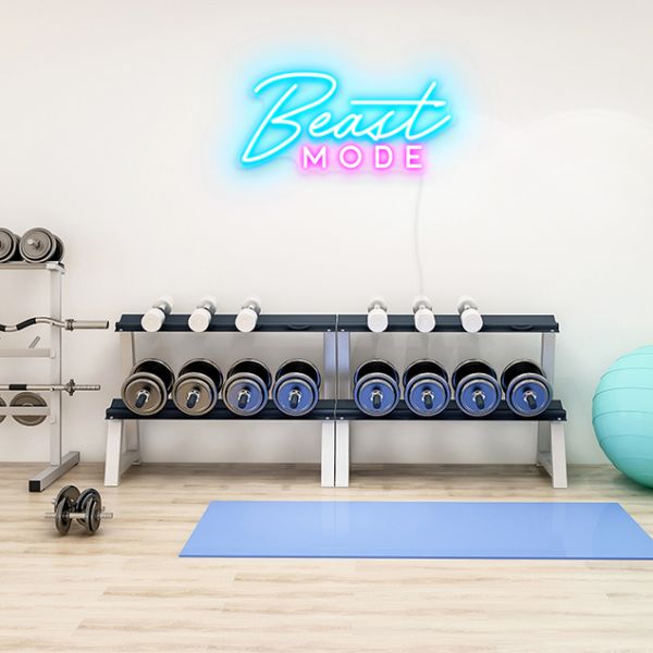Beast Mode CUSTOM NEON® Sign in blue & pink on fitness studio wall