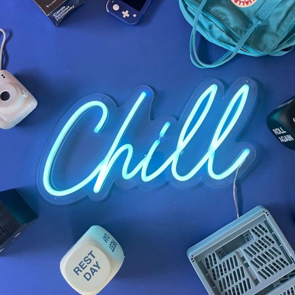 Custom Neon® light blue Chill sign shown illuminated against a dark blue  background