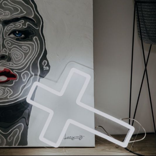 LED neon cross shown as home decor in white - photo from CustomNeon.com
