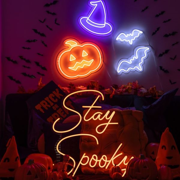 Custom Neon® Halloween light-up signs and art: orange jack-o-lantern, purple witch's hat, bats & Stay Spooky quote sign