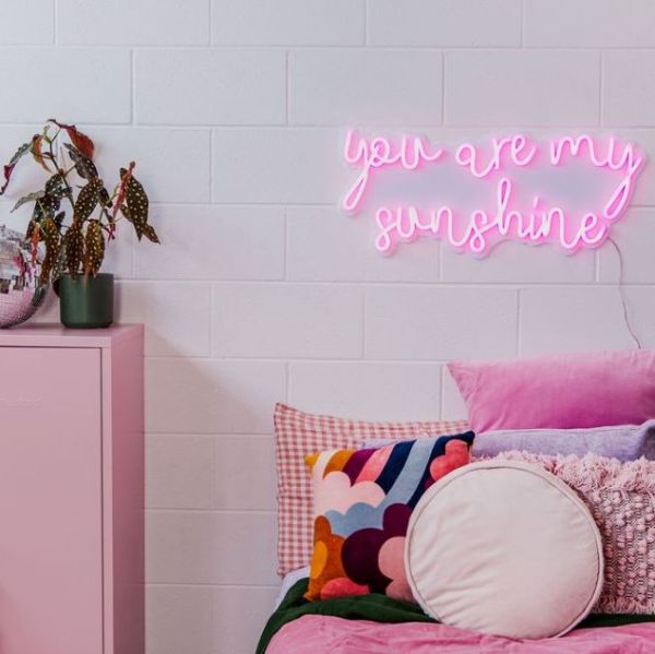 You Are my Sunshine Wall Sign in cotton candy pink LED neon flex on a white acrylic backboard - by CUSTOM NEON® 