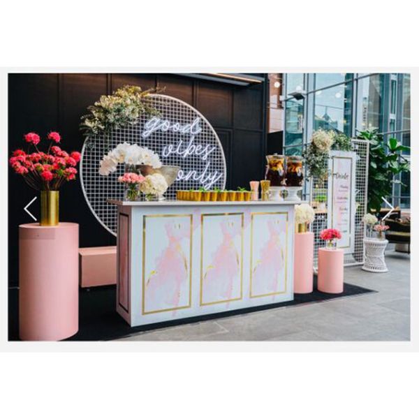 Good Vibes Only LED neon sign in 3 pieces shown behind the bar at an event - photo from CustomNeon.com