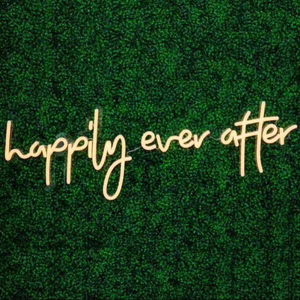Happily Ever After Portable LED Neon Sign on green wall - photo from CustomNeon.com