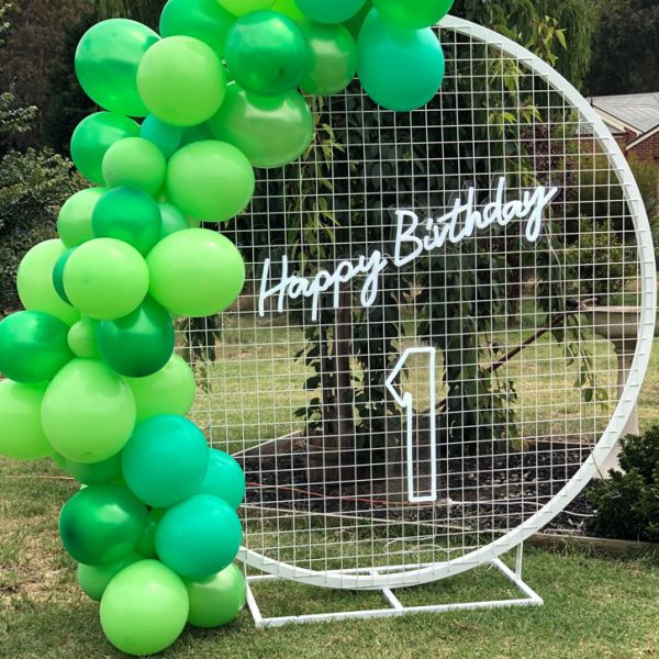 First birthday sign hung on mesh with our Happy Birthday sign (sold separately) above - photo CustomNeon.com