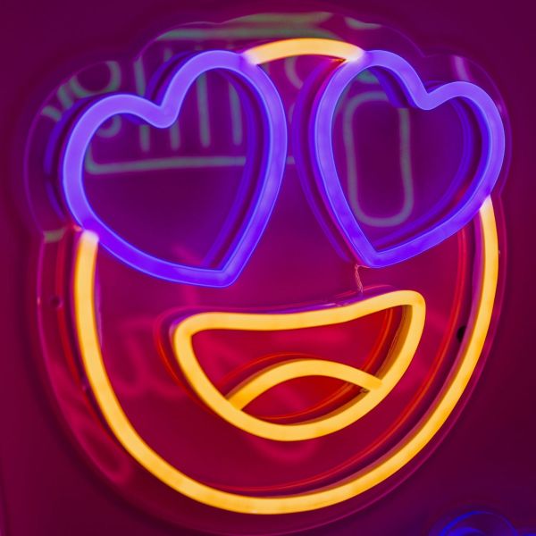 Custom Neon® Heart Eyes Emoji Sign shown in warm white and dark blue