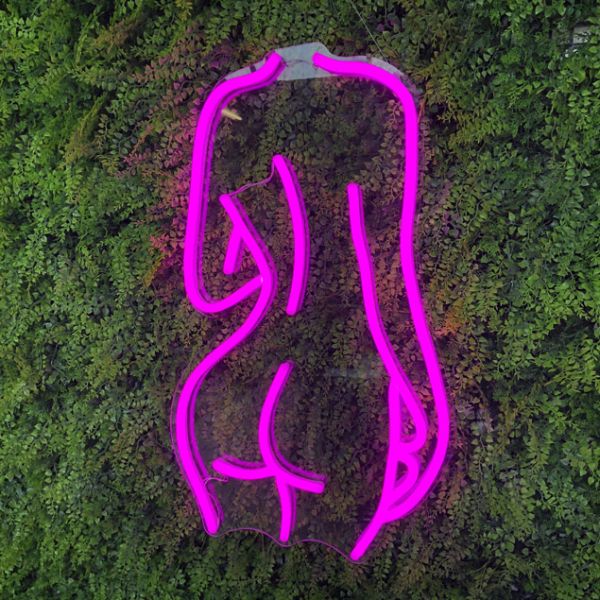 Nude Lady's Back Neon Art in Hot Pink on Green Wall by CUSTOM NEON®