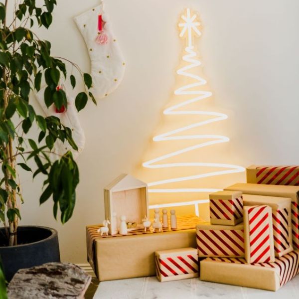 Warm white light up neon Xmas tree surrounded by a Nativity scene, Christmas stockings & presents - by CUSTOM NEON® 
