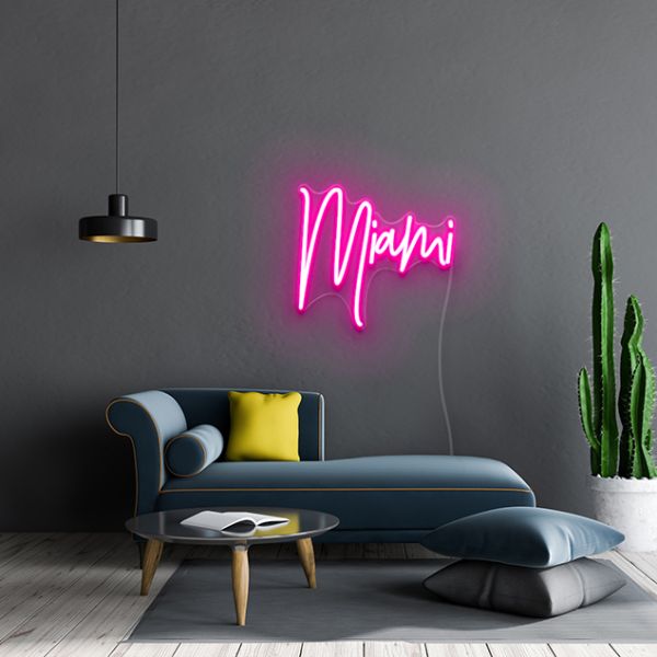 Hot pink CUSTOM NEON® Miami Sign mounted on dark wall