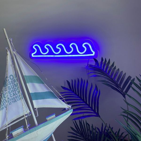 Ocean Waves Custom Neon® Sign shown in dark blue wall mounted in a living room