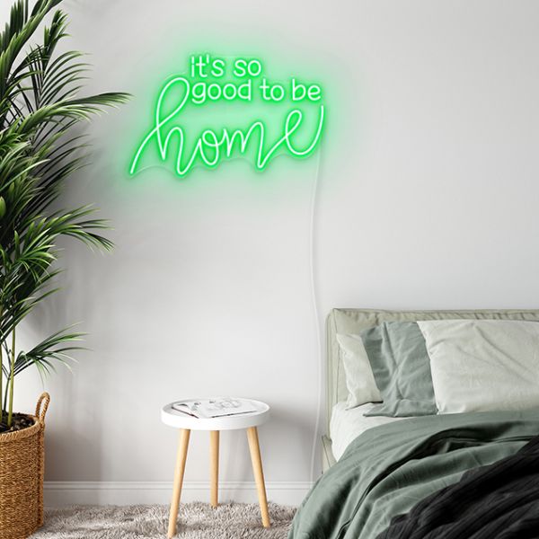 It's so Good to be Home CUSTOM NEON® wall art in green above a bed