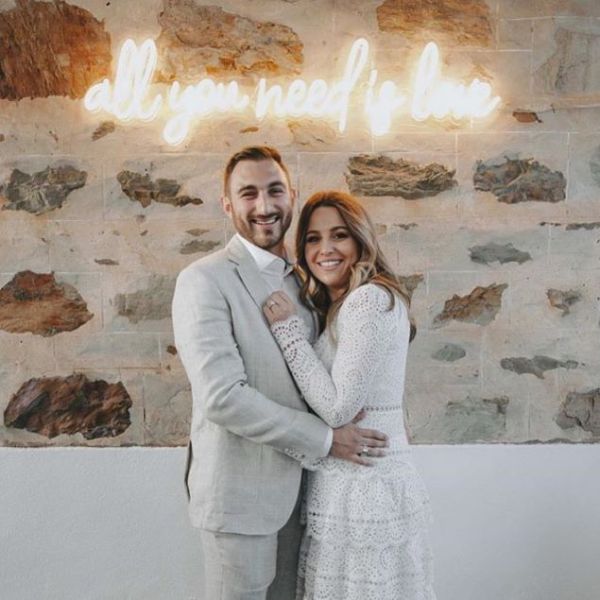 All You Need is Love LED neon wedding sign shown at an engagement party - from Custom Neon