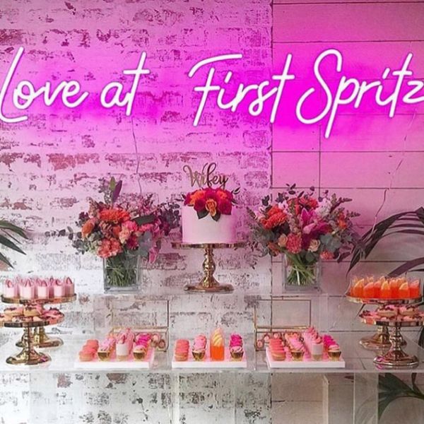Love at First Spritz LED Neon sign shown at a wedding party - sign by CustomNeon.com