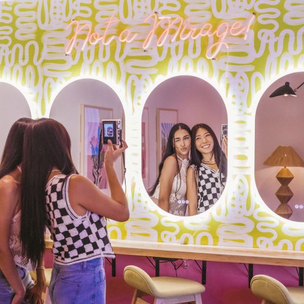 Not a Mirage! light red LED neon sign on a painted wall above selfie mirrors - CUSTOM NEON™ x SOMERLED COLLECTION