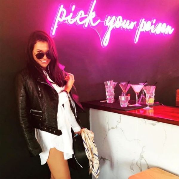 Pick Your Poison LED Neon Bar Sign shown above the bar at a party - from CustomNeon.com