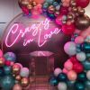 Crazy In Love Wedding Sign in brilliant LED neon flex shown in pink with balloons - photo from CustomNeon.com
