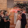 Crazy in Love LED neon wedding sign on a wooden/floral  background for wedding photo shoots - photo from Custom Neon