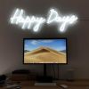 Happy Days LED neon sign shown illuminated above a monitor - from Custom Neon®