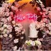 Hello Thirty neon sign surrounded by decorations and a birthday cake - from Custom Neon