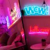 Hello Sexy red and pink light sign shown mirrored in a bedroom @customneon