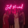 Just Married Light Up Sign hung from a wedding photo backdrop - from Custom Neon® @customneon