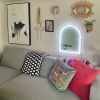 Listen Up! white & green neon art shown turned on & wall mounted above a sofa @customneon Signs of Change charity range