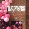 Beautiful, modern neon letter lights spelling the word LOVE with a heart for the O
 - photo from CustomNeon.com
