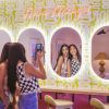 Not a Mirage! light red LED neon sign on a painted wall above selfie mirrors - CUSTOM NEON™ x SOMERLED COLLECTION