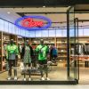 Two color LED neon open sign using the Alexa font shown in clothing store window - from CustomNeon.com