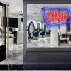 Neon look LED shop open sign in blue and red with an asymmetric outline shown in a hair salon window - from CustomNeon.com