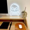 Skull & Bone white Custom Neon® art on a desk
