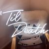 Til Death Neon Sign for Home Decor shown leaning on a chair - photo from CustomNeon.com