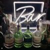 Freestanding Neon Bar Light shown on the bar at an event - photo CustomNeon.com