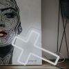 LED neon cross shown as home decor in white - photo from CustomNeon.com

