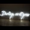 Darling, so it goes LED neon flex sign shown on a wooden table - photo from CustomNeon.com