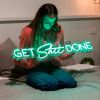 Custom Neon® green Get Shit Done wall sign shown in a bedroom setting