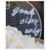 Good Vibes Only LED neon sign in 3 pieces shown on a mesh screen at an event - photo from CustomNeon.com