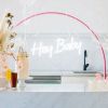 Hey Baby Light Up Sign shown with Baby Shower decorations - photo from CustomNeon.com