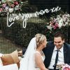 Love you more xx LED neon flex sign shown at a wedding - from Custom Neon®