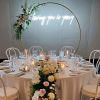 Loving you is yeezy LED neon light shown attached to a floral arch behind the top table - photo from CustomNeon.com Custom Neon® @customneon