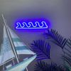 Ocean Waves Custom Neon® Sign shown in dark blue wall mounted in a living room