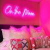 On the Moon neon light in pink shown on a bedroom wall - from Custom Neon