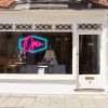LED neon flex open sign shown in a shop window - from CustomNeon.com