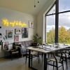 This Must be the Place yellow Custom Neon® sign on a feature wall in a living/dining room @our_build_our_journey