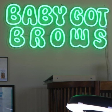 Green Custom Neon® brow salon logo sign @babygotbrows