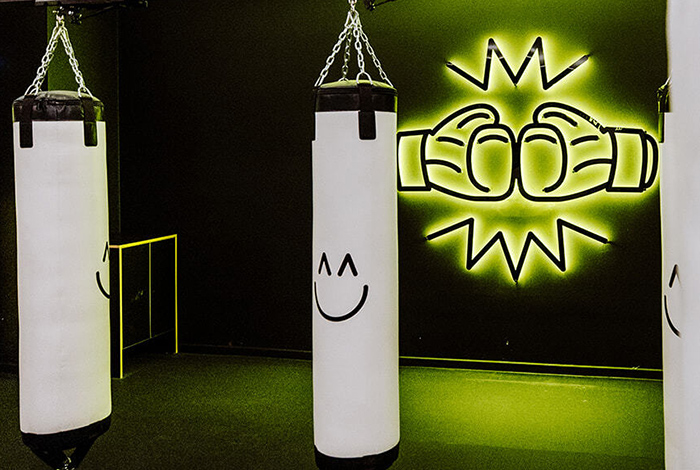 Black and green reverse lit sign