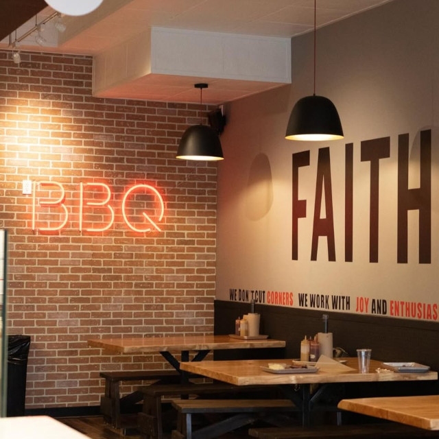 Red Custom Neon® sign on brick wall @justqinbbqd