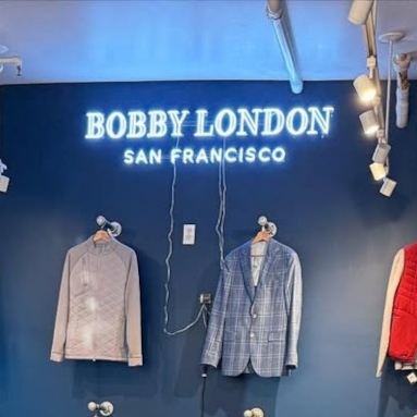 Bobby London San Francisco white Custom Neon® store name sign on a grey blue wall @bobbylondon