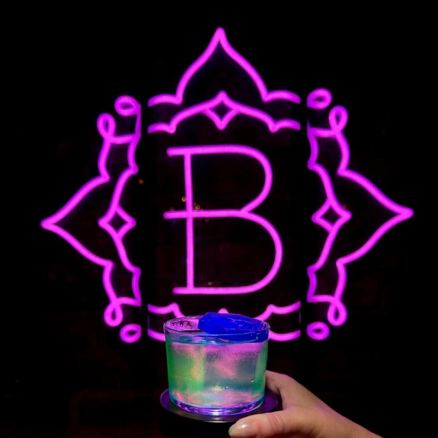 Purple restaurant logo sign by Custom Neon® @bodhi.indy